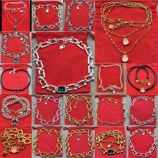 Handmade Jewelry. Necklaces and bracelets in gold/silver tones with crystal pendants and chain designs.